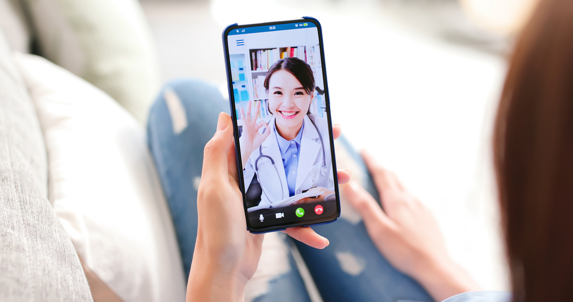 Patient Consulting with Doctor Through Video Call on Smartphone